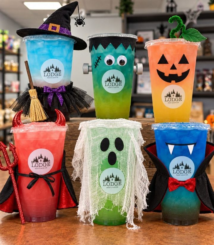 Six Halloween energy teas dressed up as a witch, Frankenstein, a jack-o'-lantern, a devil, a ghost and a vampire